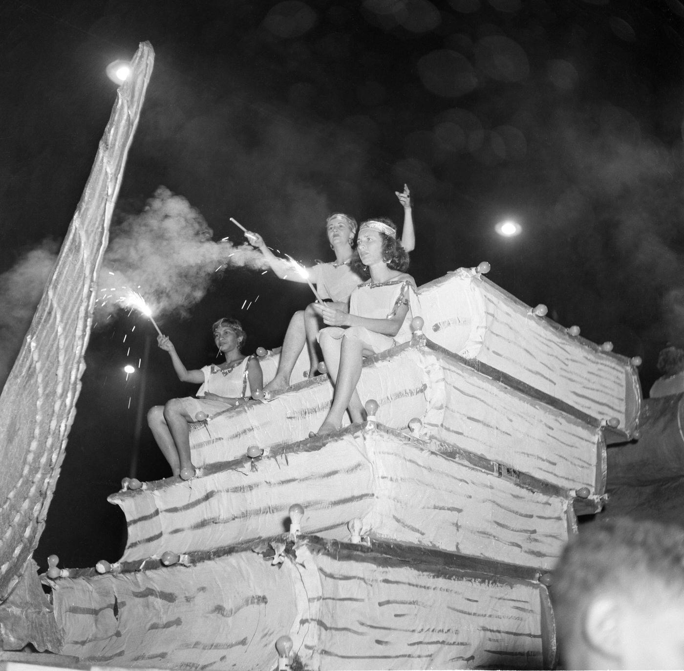 Revelers on floats during Rio de Janeiro's Carnival parade. 1953