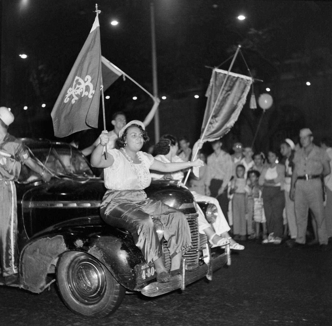 Revelers on floats during Rio de Janeiro's Carnival parade. 1953