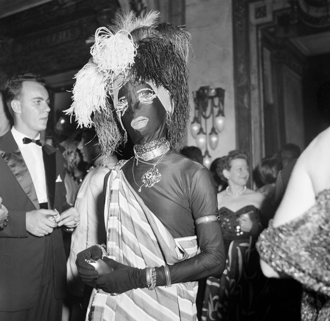 Man in costume enjoys Rio de Janeiro's Carnival festivities. 1953