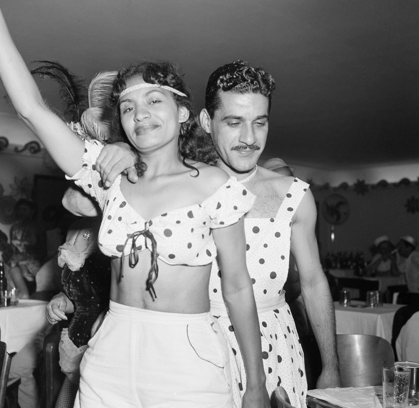 Carnival parade revelers in costumes party in Rio de Janeiro's Carnival. 1953