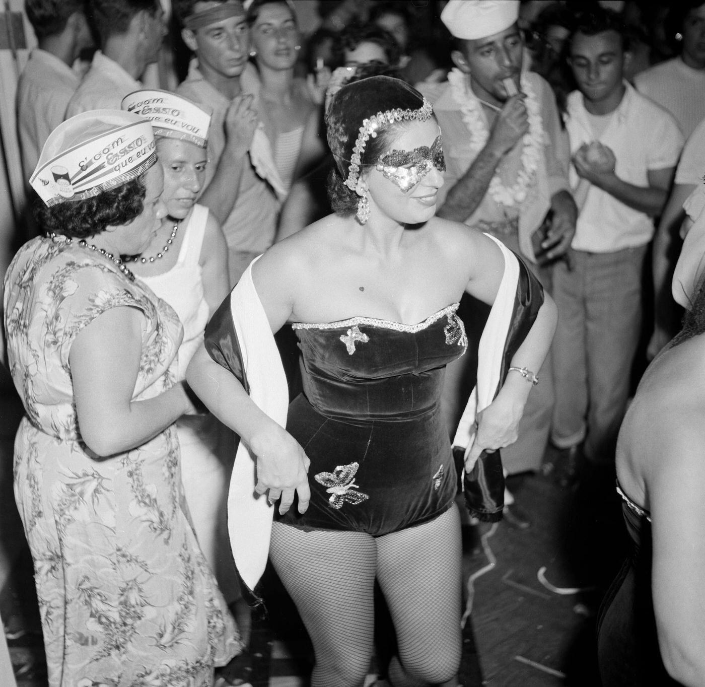 Reveler in costume parties in Rio de Janeiro's Carnival. 1953