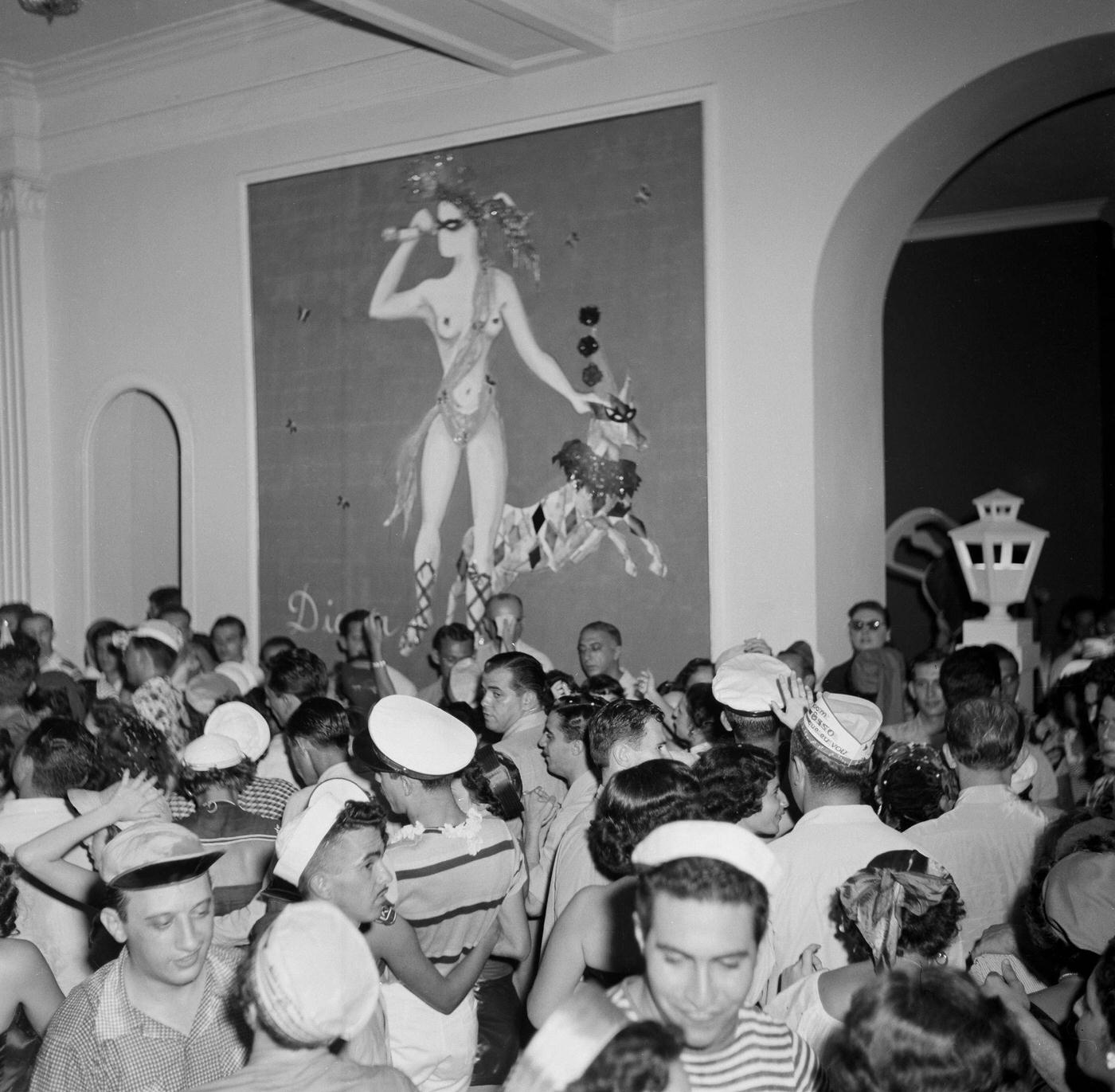 Carnival parade revelers in costumes party in Rio de Janeiro's Carnival. 1953