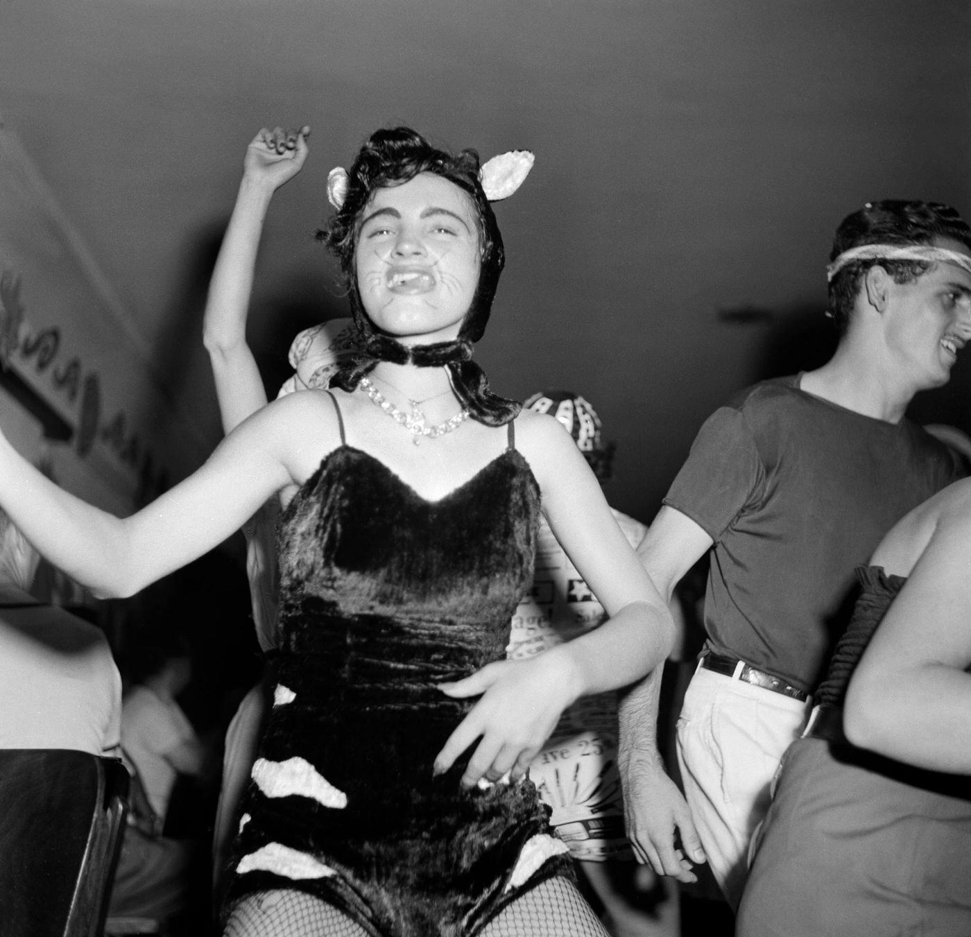 Reveler in costume parties in Rio de Janeiro's Carnival. 1953