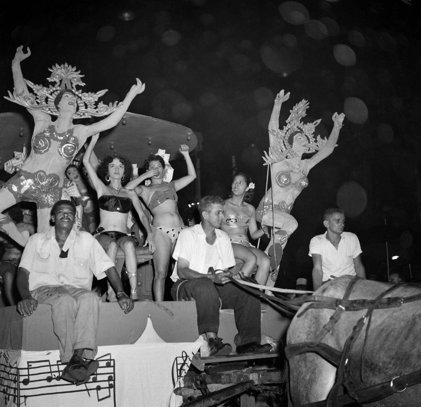 Revelers on floats during Rio de Janeiro's Carnival parade. 1953