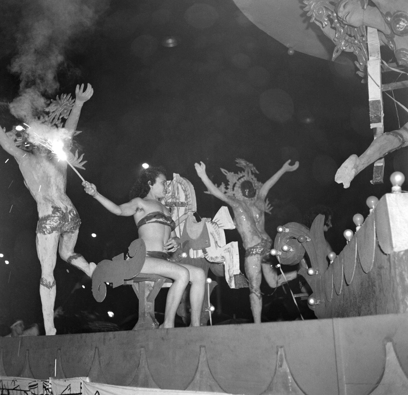 Revelers on floats during Rio de Janeiro's Carnival parade. 1953