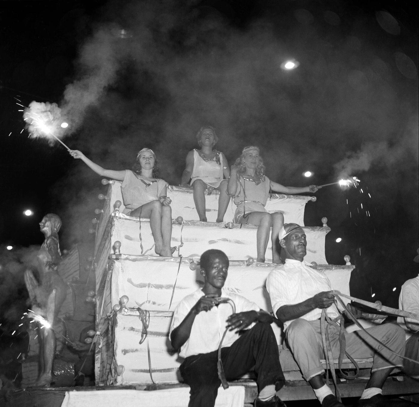 Revelers on floats during Rio de Janeiro's Carnival parade. 1953