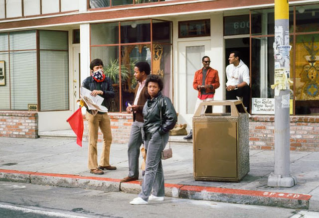 Masked Man Selling Newspapers, 24th Street, 1984