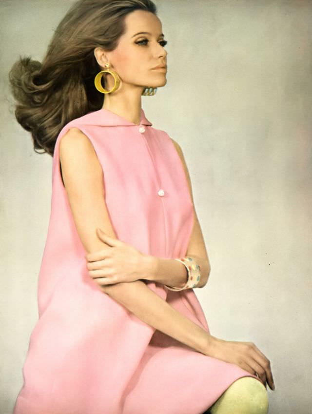 Veruschka in a pink crêpe dress with a hooded collar, Vogue, 1967