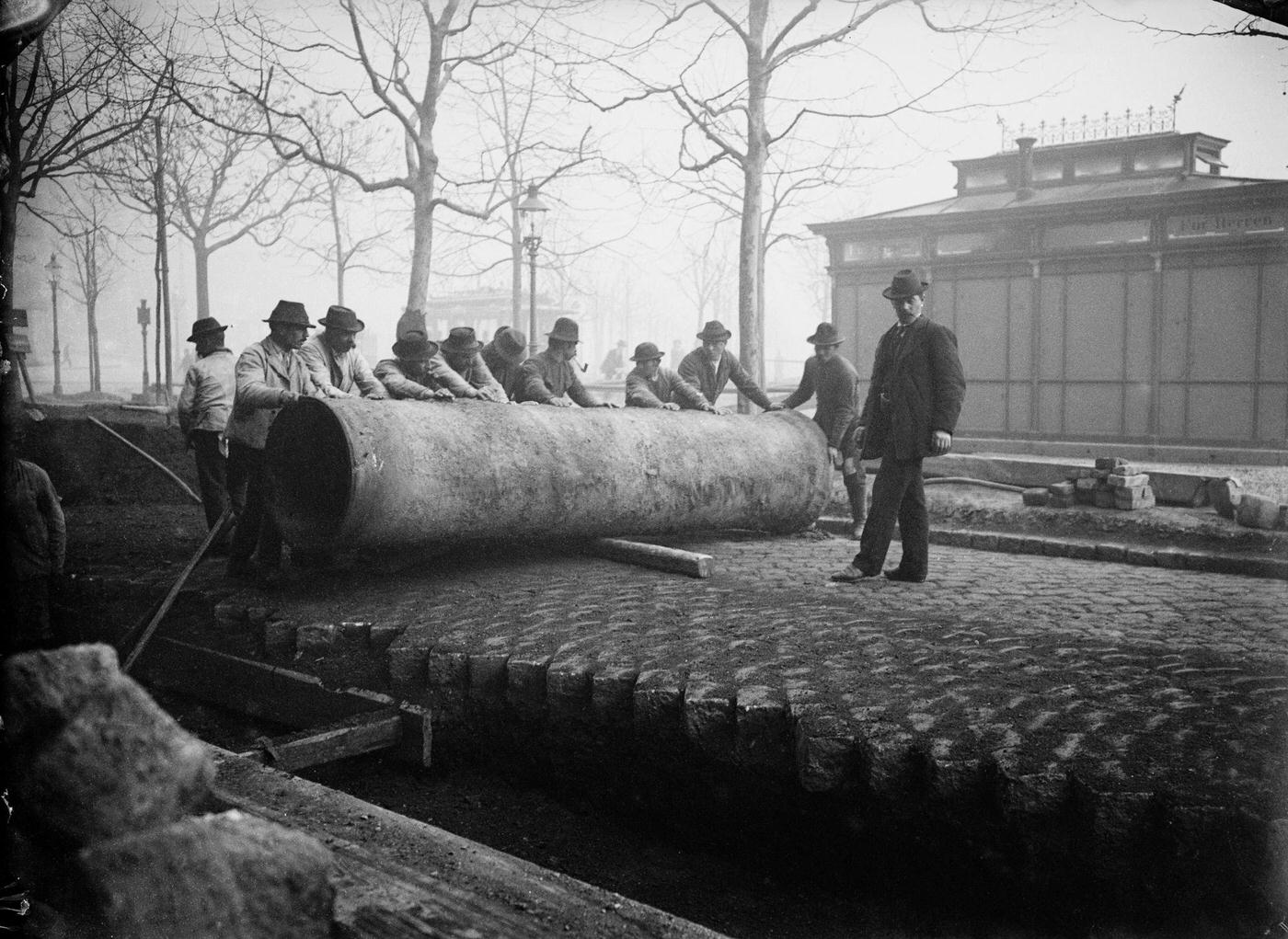Man piping a sewer pipe, Vienna, 1900s