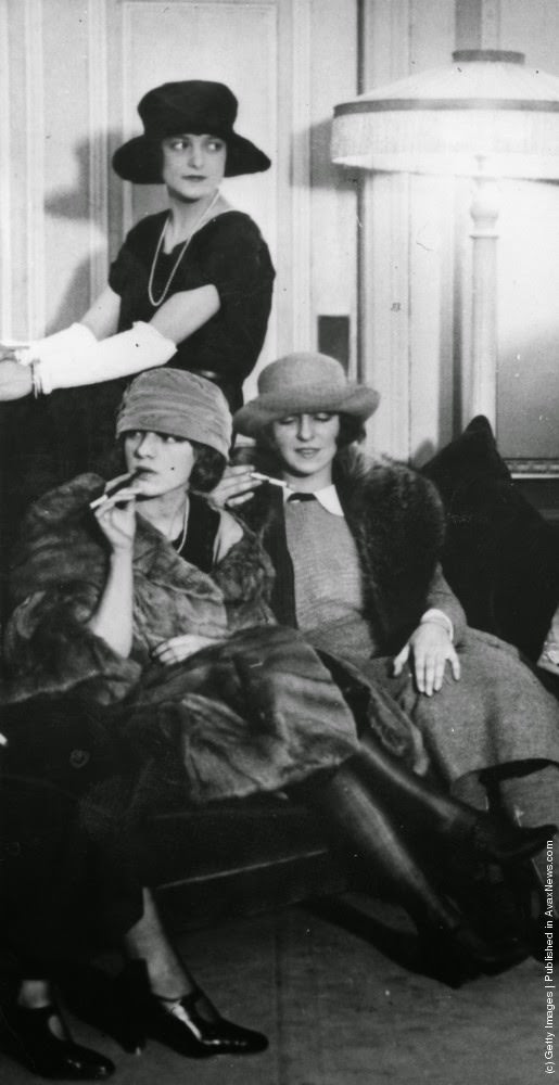 Women in the smoking lounge of the Globe Theatre, New York, 1930