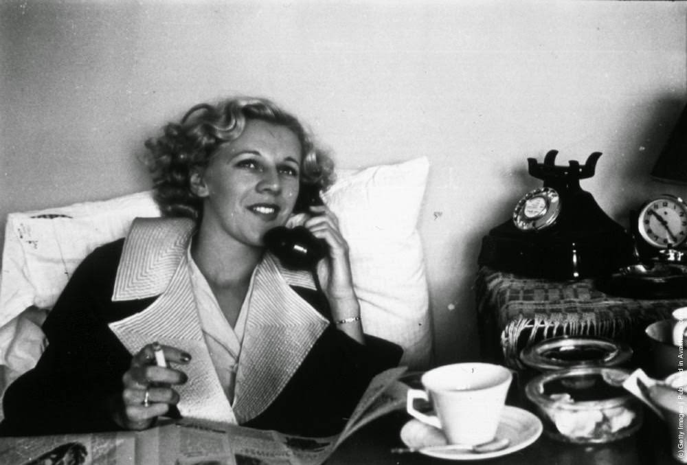Janet Allen, a professional dancing partner at Streatham Dance Hall, enjoying breakfast in bed. 1939