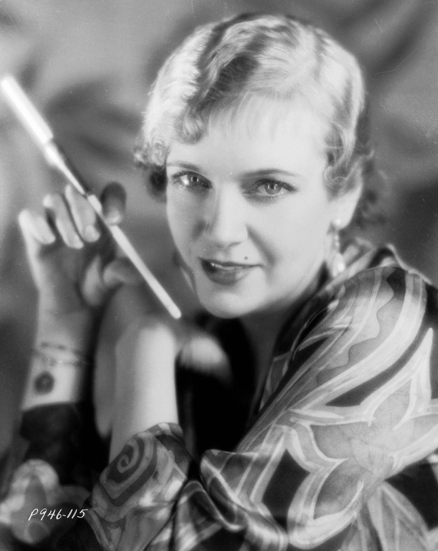 Russian actress Olga Baclanova holding a cigarette holder, 1930s