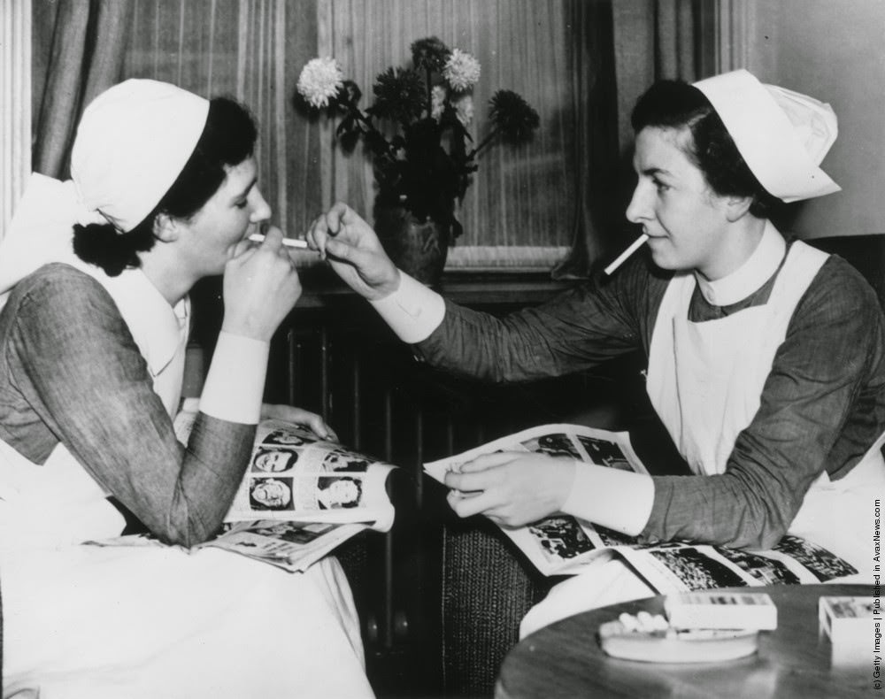 Nurses at the Salford Royal Hospital take advantage of the newly-opened smoking facilities, providing a smoke room for off duty staff, 1938