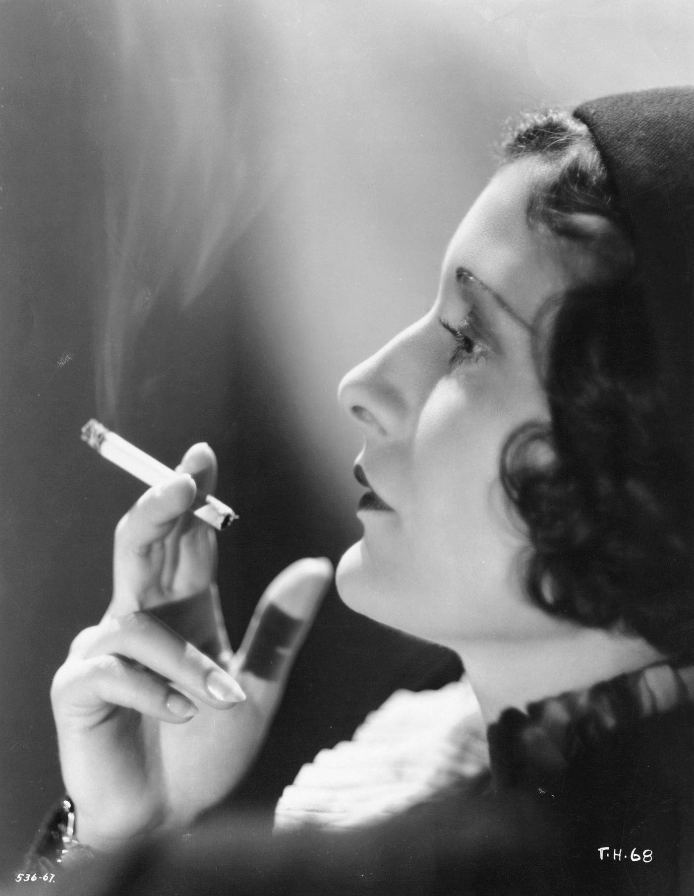 Actress Evelyn Brent playing the lead role of Ruby Smith in the comedic crime film Traveling Husbands, 1931.