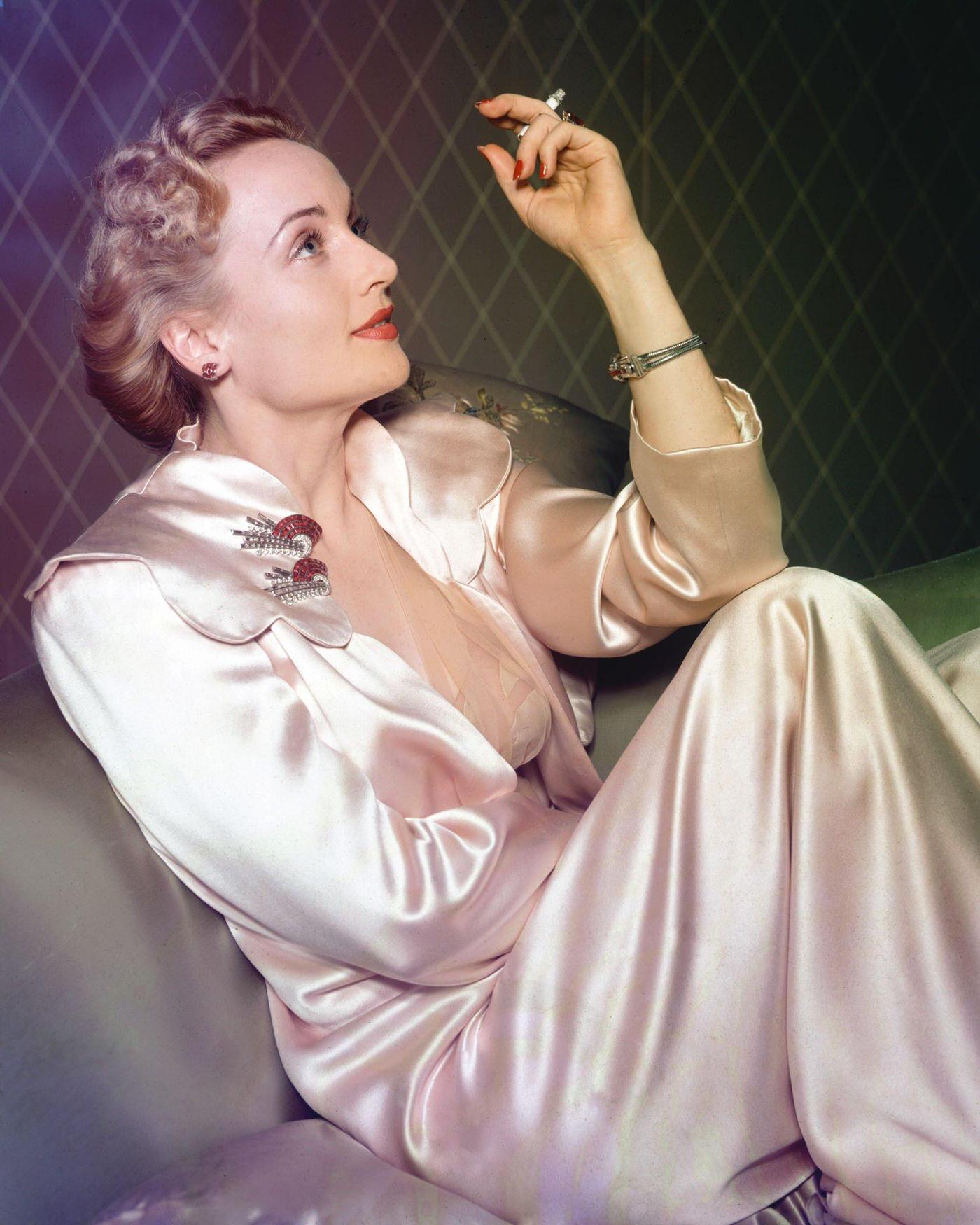 American actress Carole Lombard in a satin dressing gown, 1935