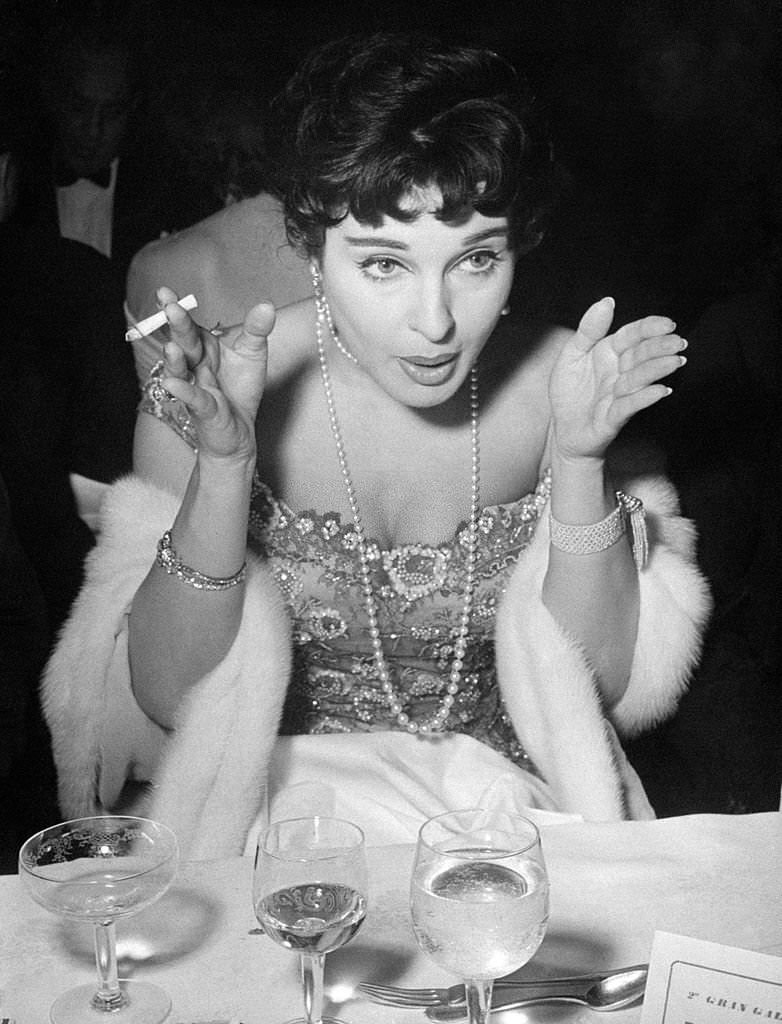 Italian actress Silvana Pampanini smoking a cigarette during the International Film Festival of Punta del Este, 1950s.