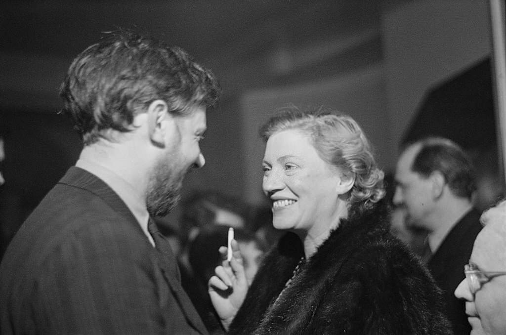 Frederick Laws and American photographer Lee Miller smoking at a one-night performance in London, March 1950.