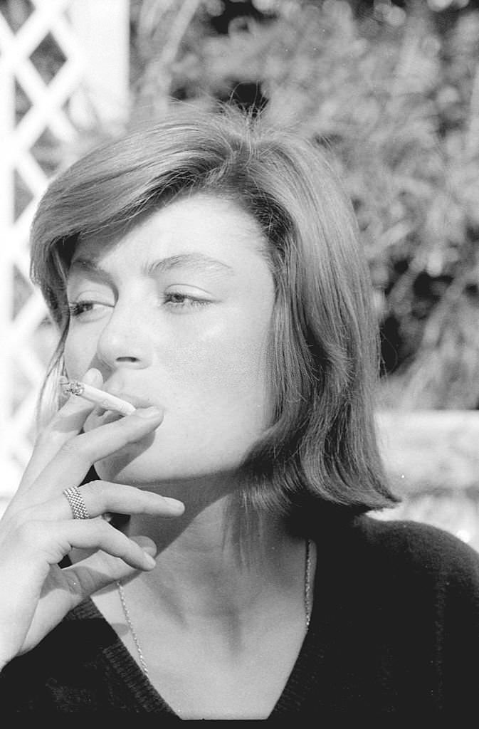 French actress Anouk Aimée smoking during the XVI Venice International Film Festival, Venice, 1955.