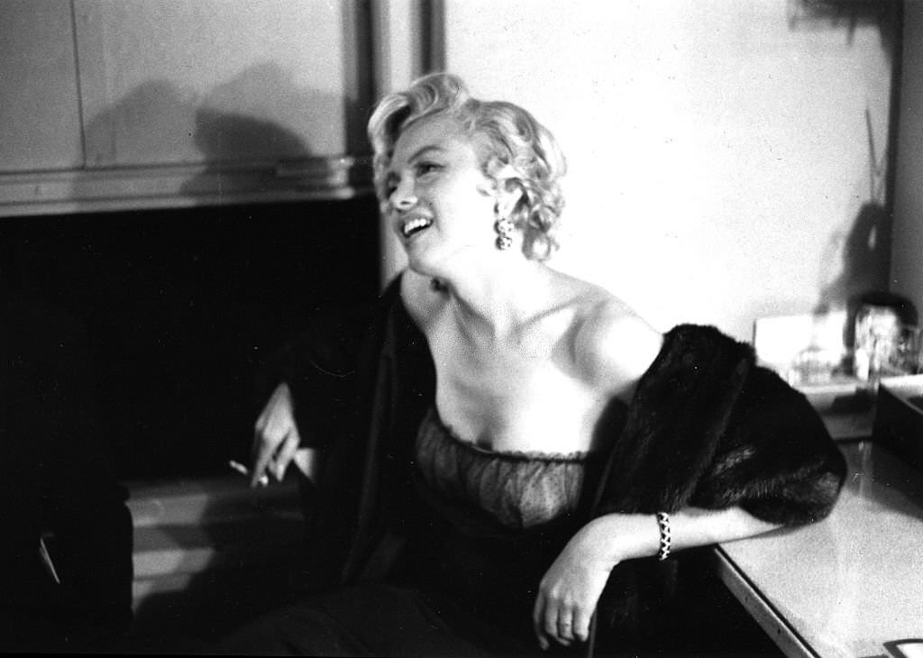 Marilyn Monroe smoking a cigarette backstage at a Broadway Theater in New York, 1954.