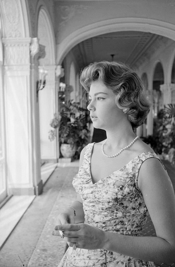 Italian actress Lorella De Luca smoking a cigarette at the Venice International Film Festival, 1958.