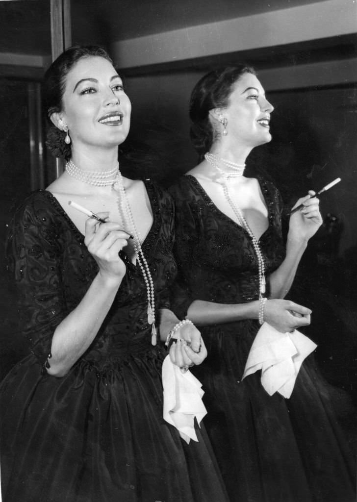 American actress Ava Gardner at a press reception at the Savoy Hotel, London, 1955.