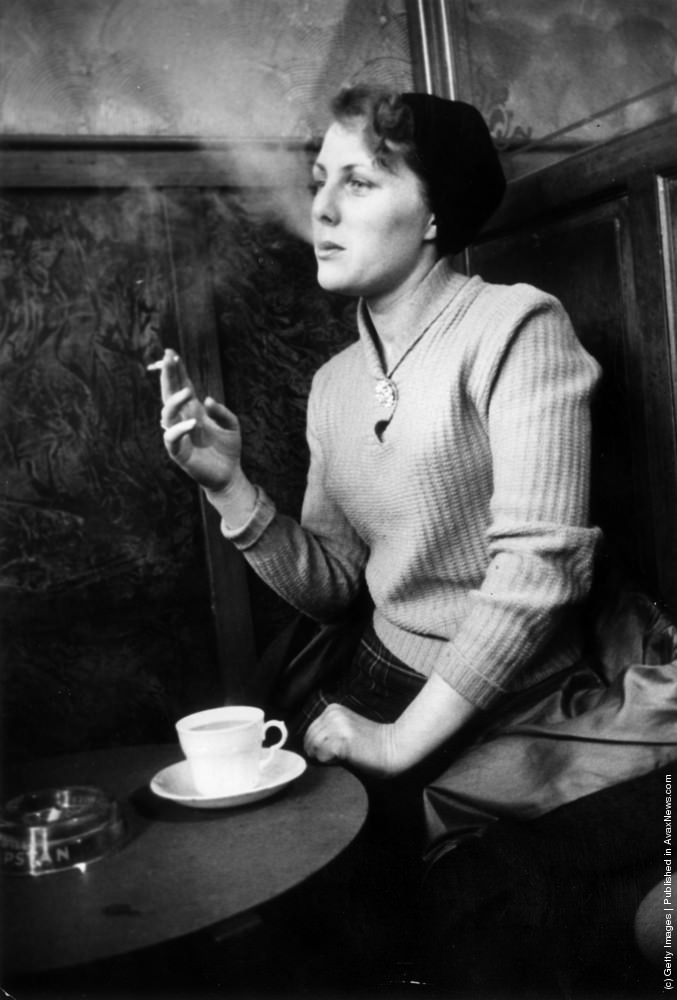 A woman smoking in Newcastle. 19th March 1955.