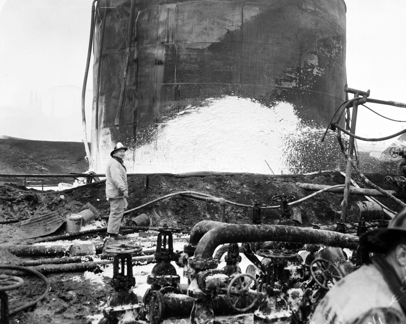 Hancock Oil Fire Clean-Up Shows Last Wisps of Smoke, 1958