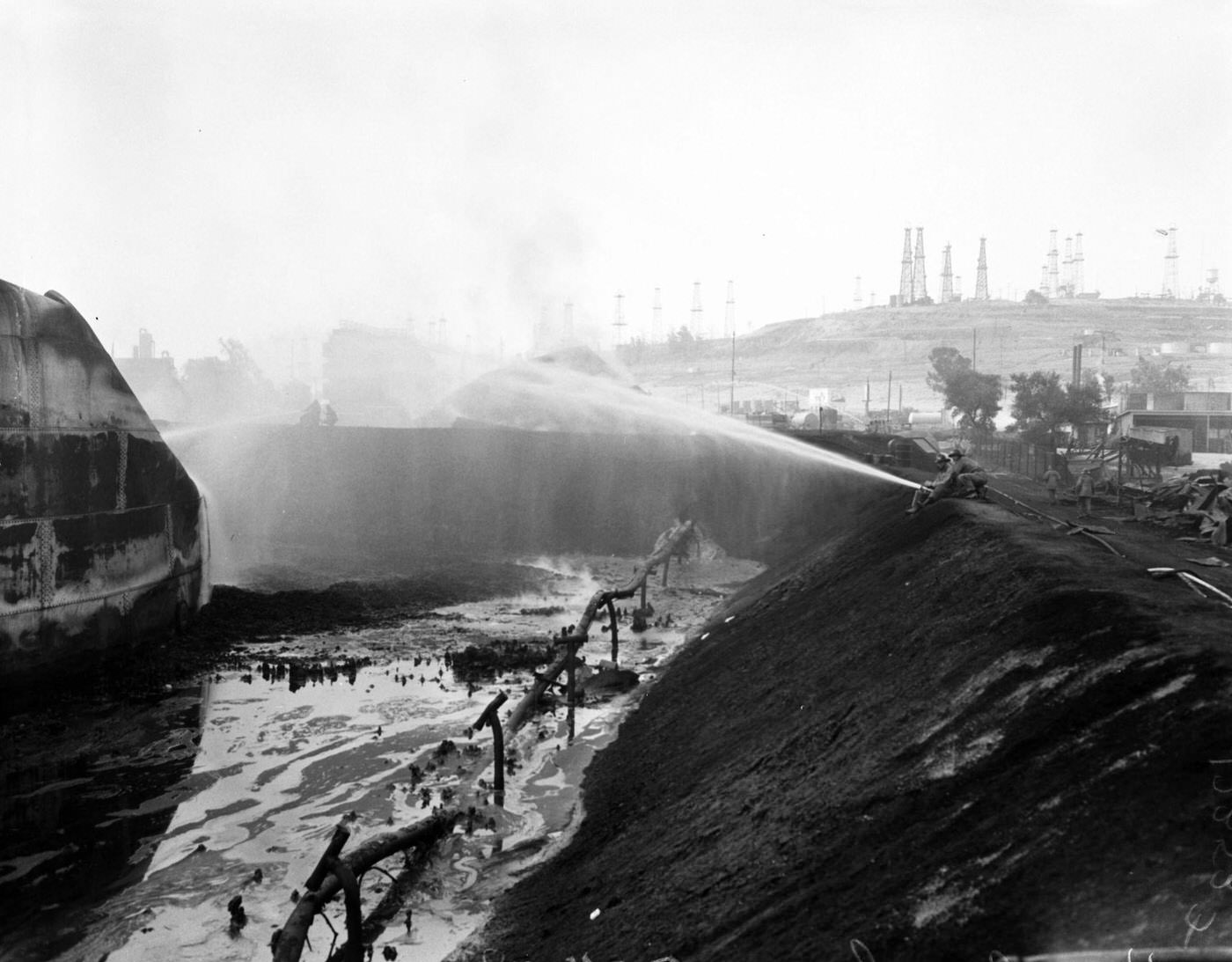 Hancock Oil Fire Clean-Up with Damaged Cars in Foreground, 1958