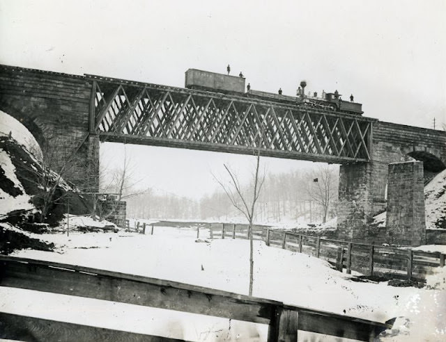 Lake Shore & Michigan Southern Howe Truss Bridge over the Ashtabula River. Erected after the December 1876 bridge collapse. Ashtabula, Youngstown & Pittsburgh Railroad boxcar on bridge