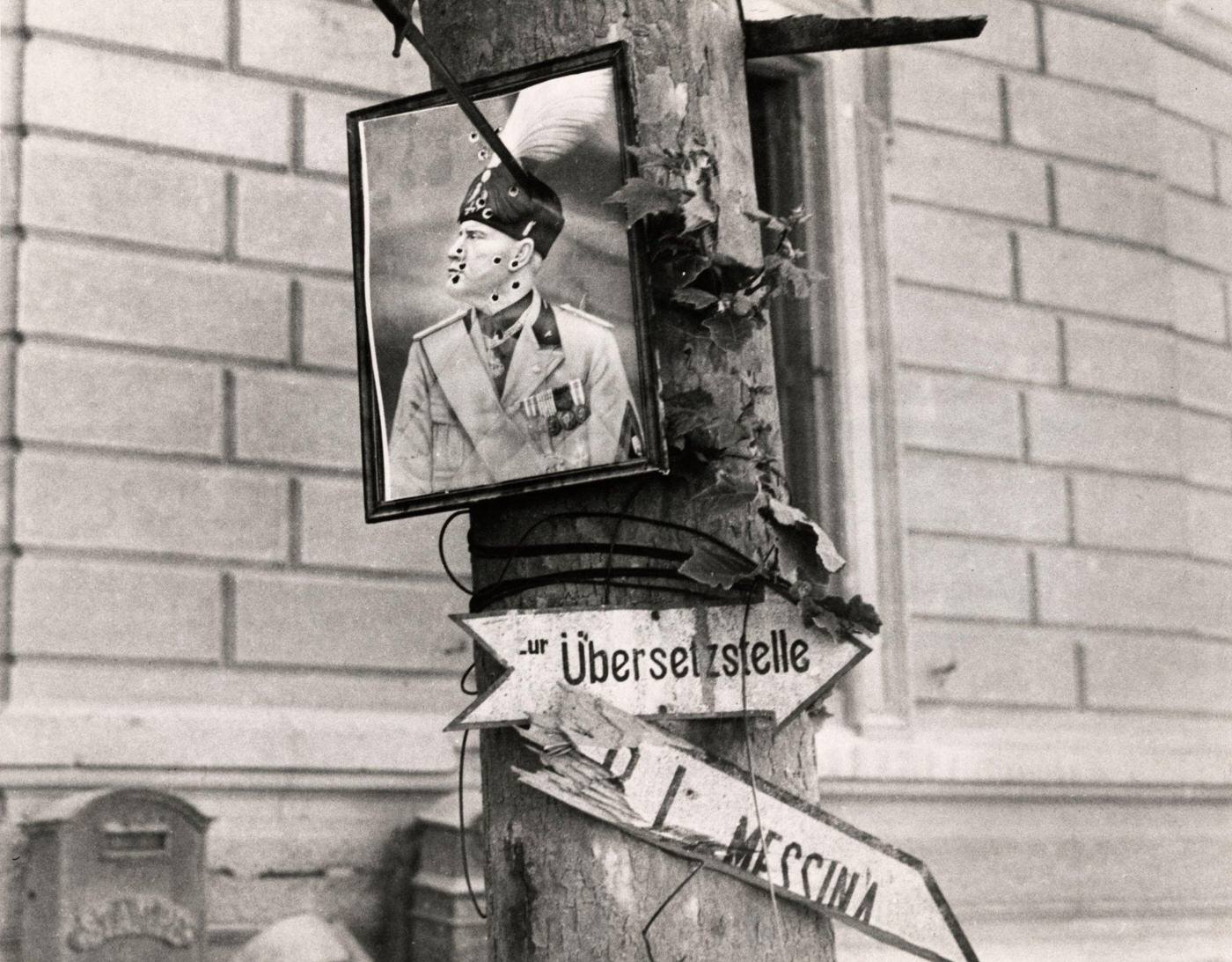 Bullet-Riddled Portrait of Benito Mussolini Hanging from a Tree in Messina, Sicily, 1943