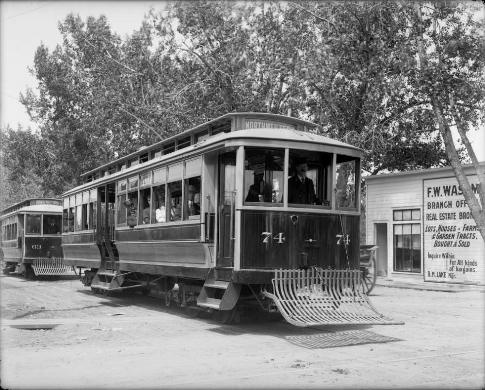 Passengers ride on Denver Tramway cars No. 74 and 63 at West 38th Avenue and Tennyson Street, Denver, 1900