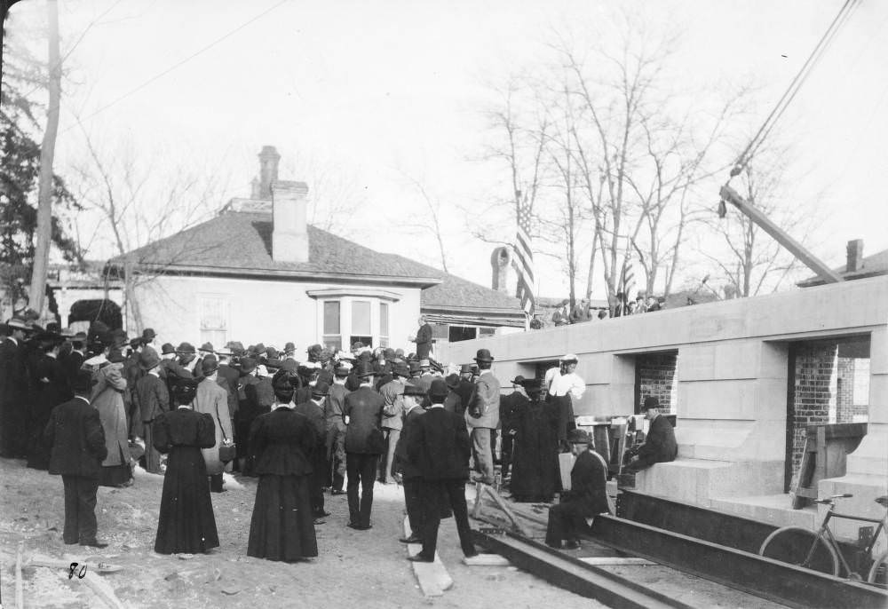 Governor Henry Buchtel speaking at Denver Public Library cornerstone ceremony, U.S. flag in background, 1900s