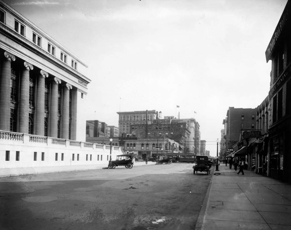 Stout Street in Denver with Cars and Denver Tramway Streetcar, 1900s