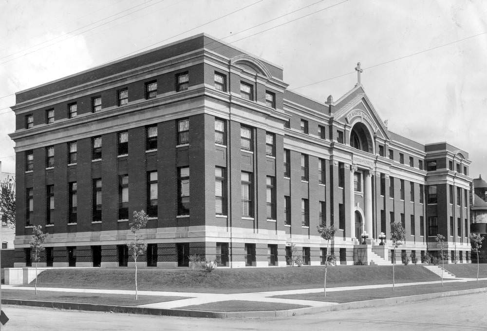 Saint Mary's Academy, Capitol Hill, Denver featuring stone trim and a cross, 1900s