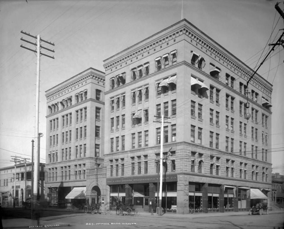 McPhee Building on 17th and Glenarm, featuring early automobiles, 1906.