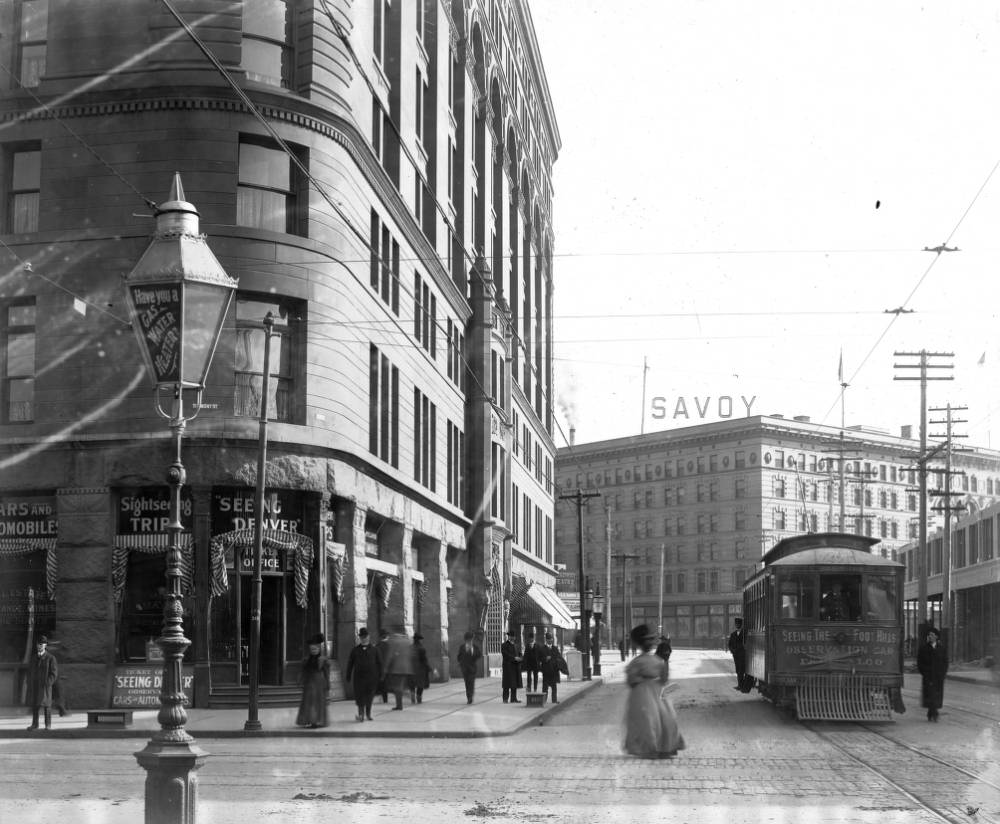 Denver Tramway "Seeing The Foothills" trolley on 17th Street, featuring Brown Palace and Savoy Hotel, 1905.