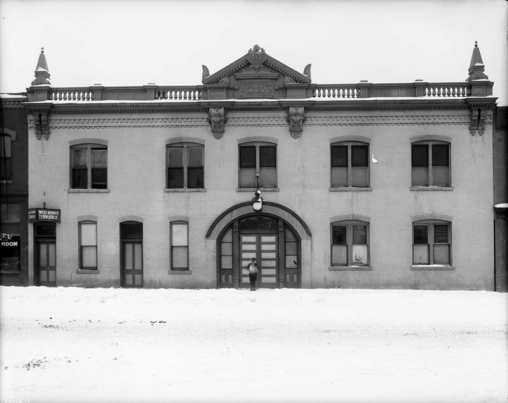 Denver Turnverein Meeting Hall, showcasing its brick architecture and arched entry, 1900