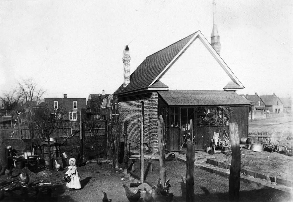 Yard at 742 South Emerson Street with a Girl Feeding Chickens, Denver, 1907.
