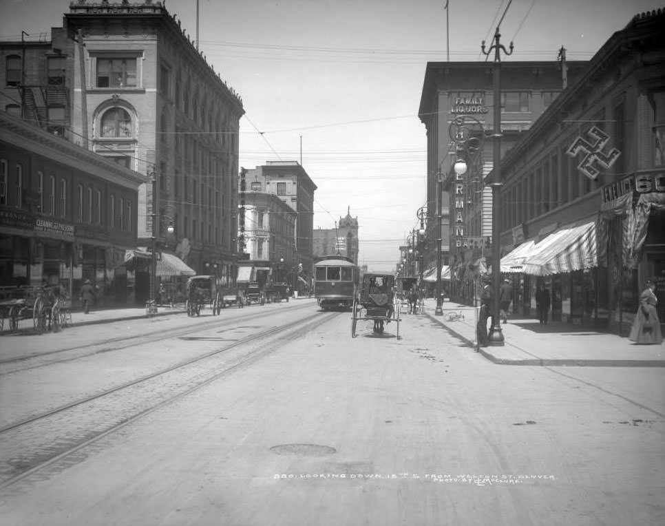 View down 15th Street from Welton, featuring various modes of transport, 1900