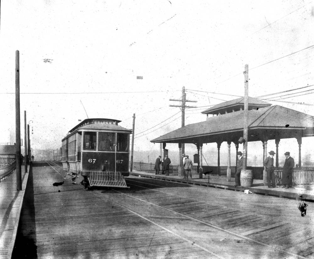 Trolley number 67 at Union Station on 16th Street viaduct, featuring a covered stop, 1905.