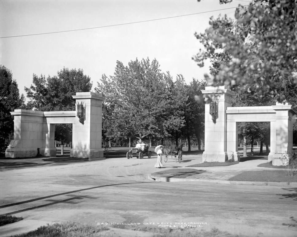 McLellan Gate at City Park, Denver, showing cars and pedestrians, completed in 1904