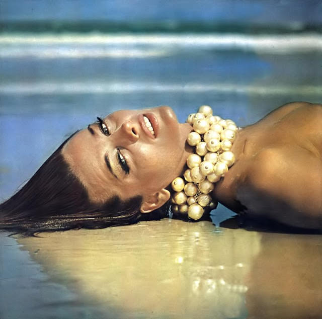 Dolores Wettach wearing golden fake-pearl necklaces at Wanda Beach, Australia, June 1964
