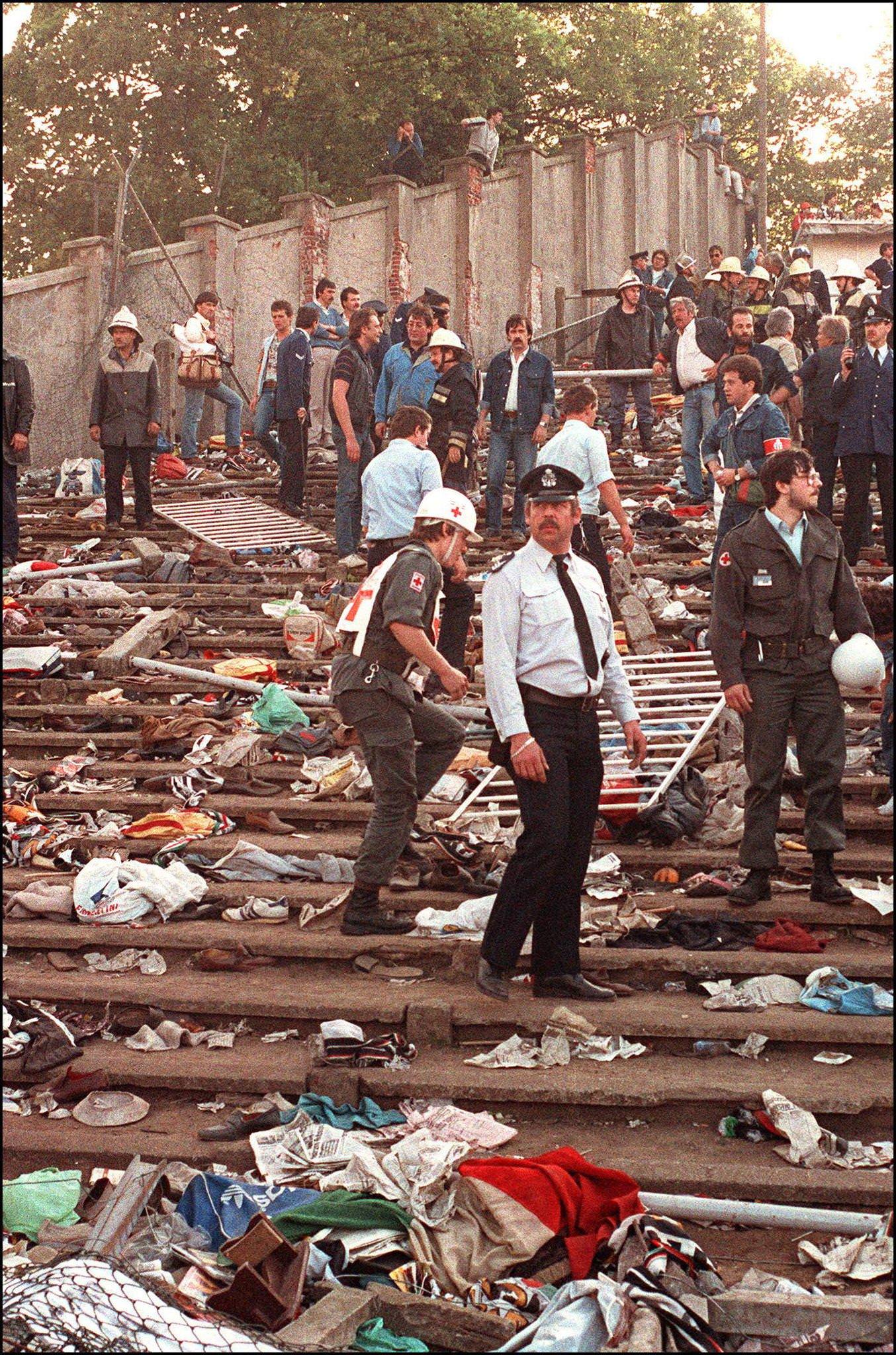 Rescuers search for victims after Heysel Stadium riots, European Cup Final, 1985.