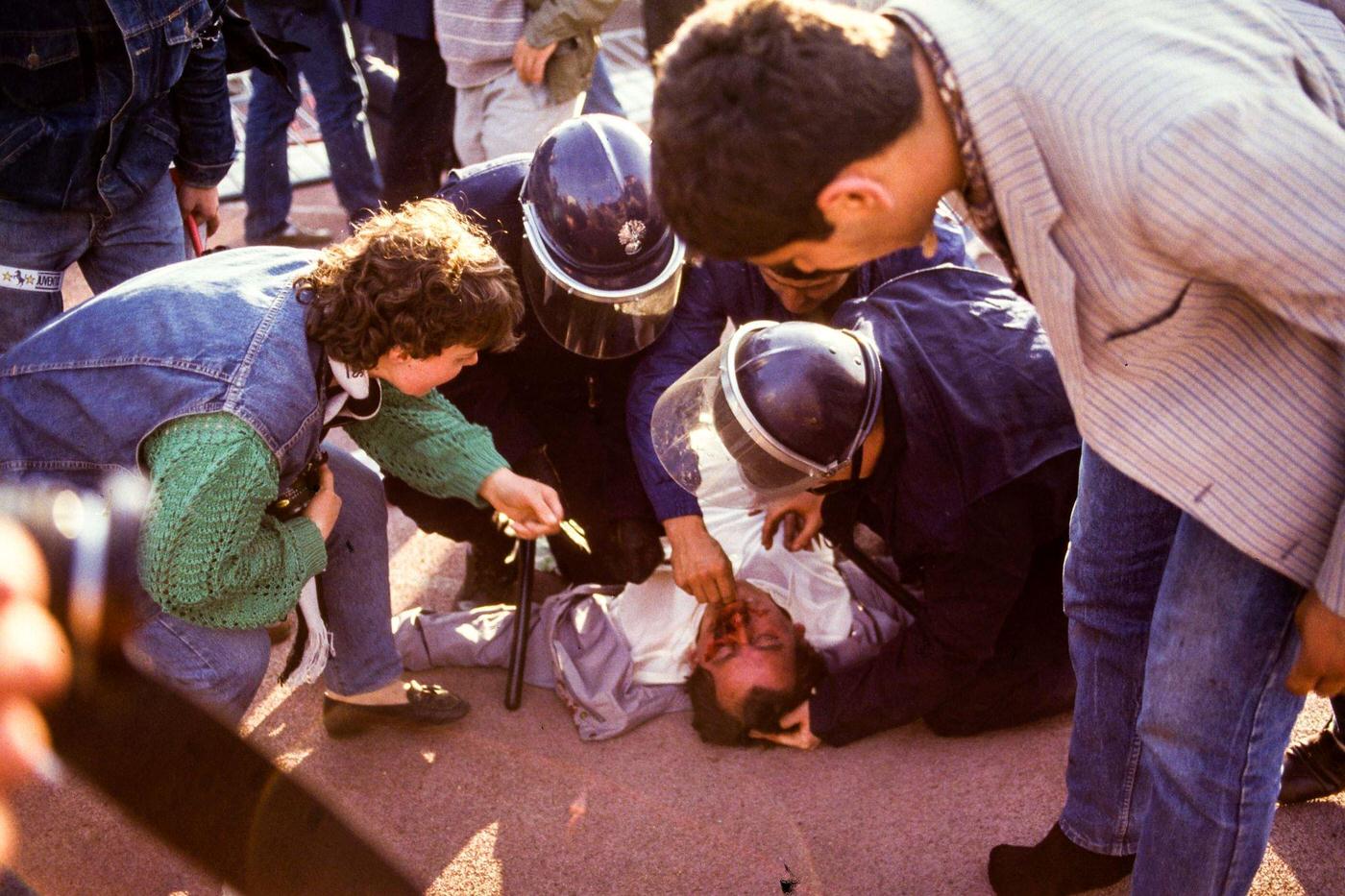 Supporter receives first aid by security police at Heysel Stadium, European Cup Final, 1985.