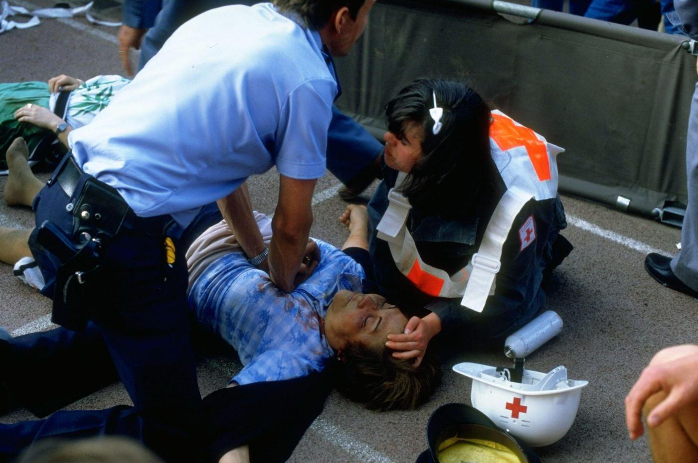 Supporter receives first aid during crowd riots at Heysel Stadium, European Cup Final, 1985.