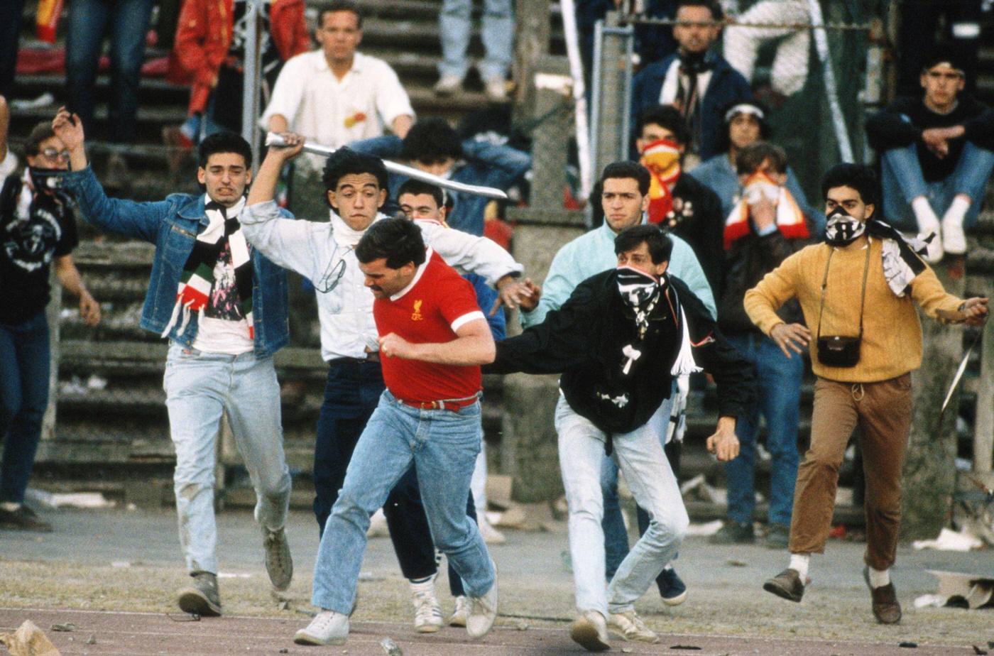 Liverpool fan chased by Juventus fans at Heysel Stadium, European Cup Final, 1985.