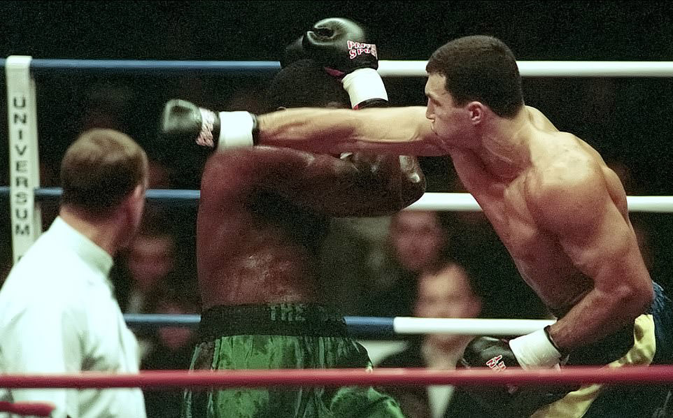 Boxing in Kyiv: Mayor's brother Wladimir narrowly dodges a punch in a tense match, 1998.