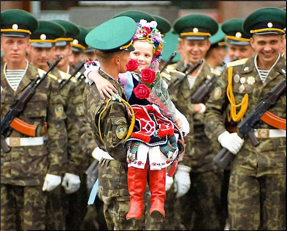 May Day Parade: Little girl in national costume carried by soldiers, 1999.