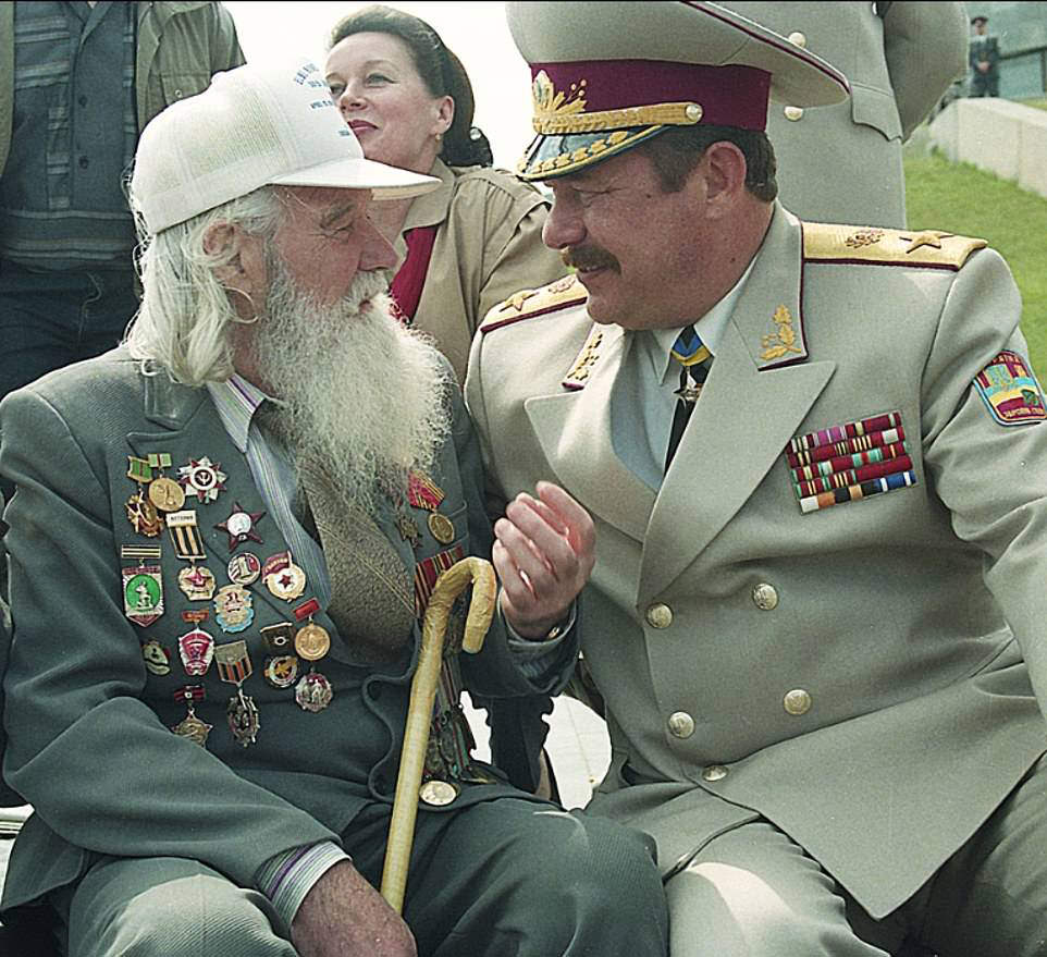 WWII Remembrance: Ukrainian officials celebrate the end of WWII wearing medals, 1999.