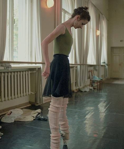 Pointe Technique: A ballet dancer practices her pointe work in a studio